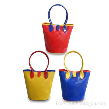 PVC Handbags with Fully Embossed Logo, Round Handle, Fully Printed Lining and Snap Strap Closure